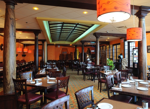 Karaikudi spacious dining with rosewood pillars showing the bamboo lattice