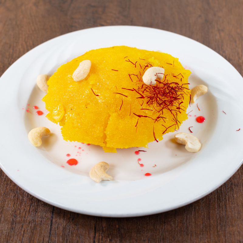 Traditional South Indian Pineapple Kesari sweet dessert garnished with cashews at Karaikudi Chettinad Restaurant