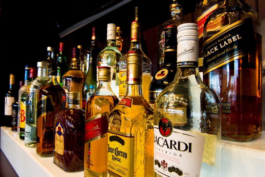 Fully licensed restaurant bar with a premium liquor display and cocktail selection at Karaikudi Chettinad in Scarborough